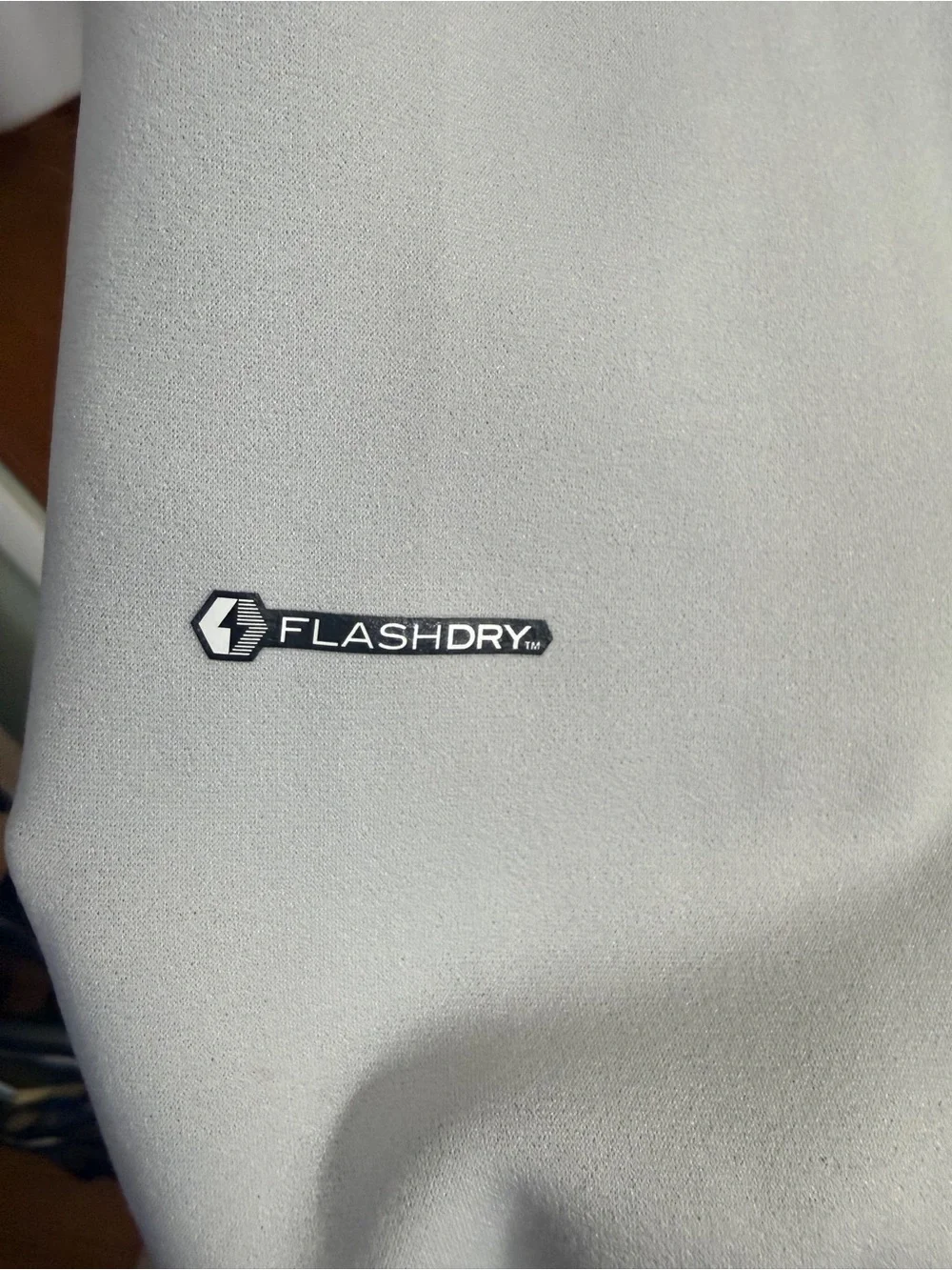 The North Face Light Gray Jacket with Black Logo Tag